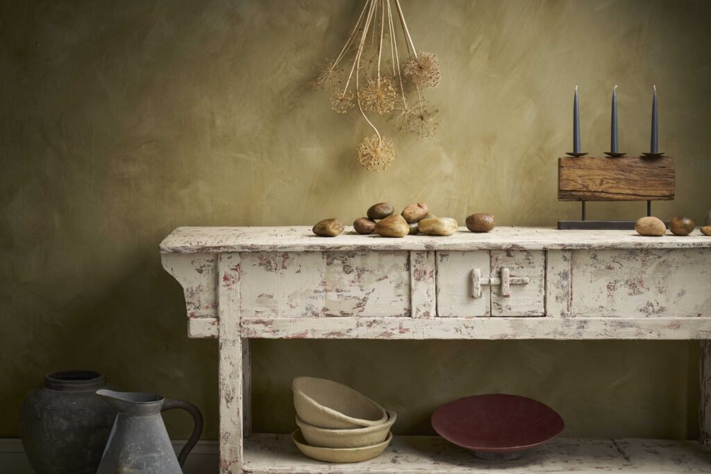 Vintage wooden console table painted in Canvas Annie Sloan Chalk Paint with rustic decor.
